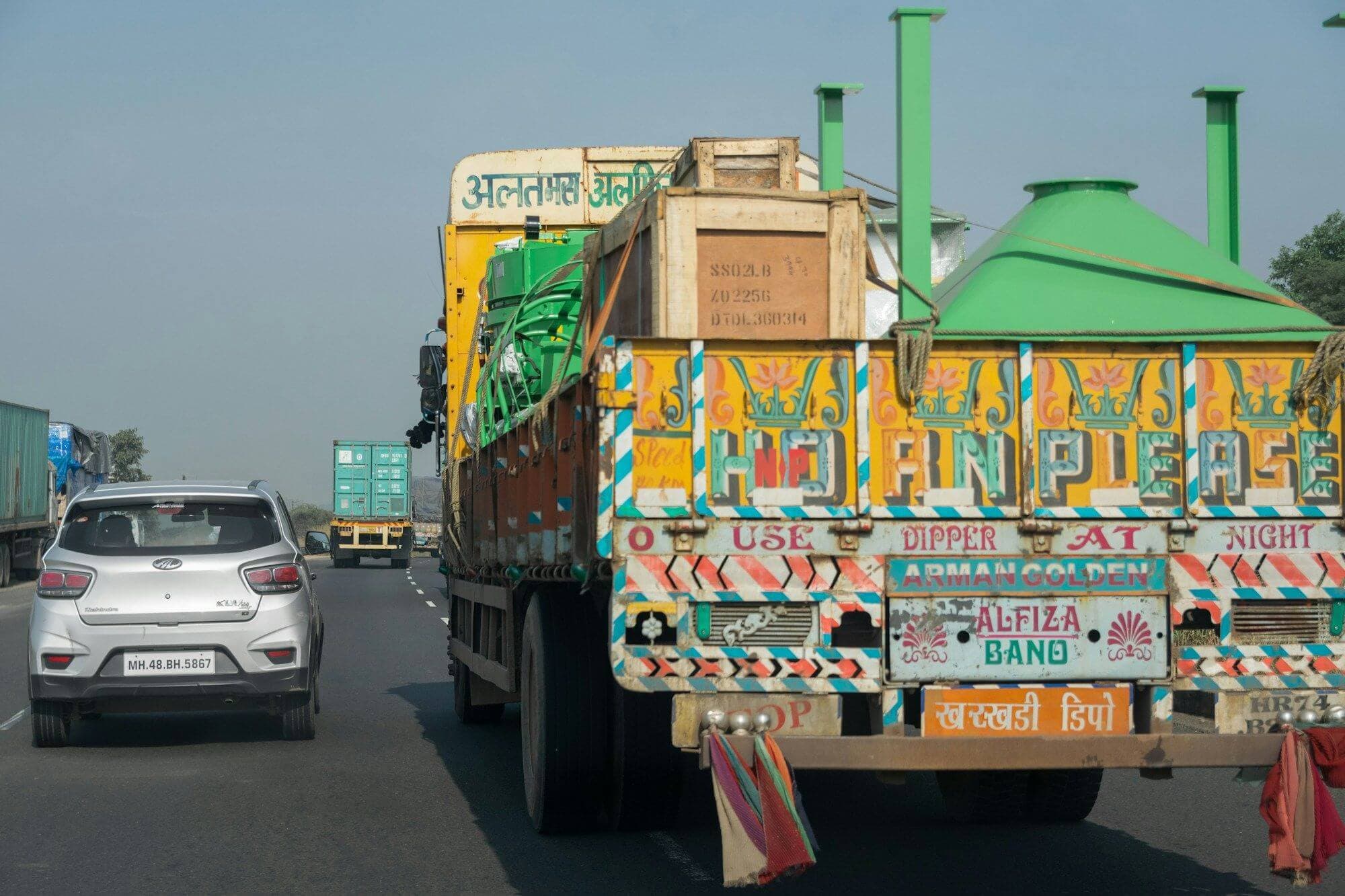 Colourfully painted Indian goods truck carrying cargo on a highway